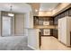 Updated kitchen featuring granite countertops, stainless appliances, and open layout at 32 E Serene Ave # 207, Las Vegas, NV 89123