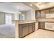 Open concept kitchen features breakfast bar and leads into the living space at 32 E Serene Ave # 207, Las Vegas, NV 89123