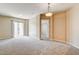 Spacious living area with neutral carpet, open layout and balcony access at 32 E Serene Ave # 207, Las Vegas, NV 89123