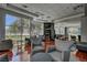 Inviting lounge with plush chairs, large windows offering scenic views, and a well-stocked bookshelf for residents at 32 E Serene Ave # 207, Las Vegas, NV 89123