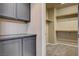 Walk-in Closet featuring cabinets and open shelving, and neutral carpeting at 32 E Serene Ave # 207, Las Vegas, NV 89123
