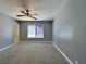 Bedroom featuring carpet, ceiling fan, and bright window at 349 Esquina Dr, Henderson, NV 89014