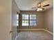 Comfortable bedroom featuring a large window and a mirrored closet, providing ample natural light and space at 349 Esquina Dr, Henderson, NV 89014