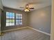 Bedroom with a ceiling fan and large windows at 349 Esquina Dr, Henderson, NV 89014