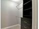 Walk-in closet featuring carpet, shelving, gray walls, and clothing rods at 349 Esquina Dr, Henderson, NV 89014