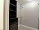 Walk-in closet featuring carpet, shelving, gray walls, and clothing rods at 349 Esquina Dr, Henderson, NV 89014