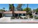 Inviting single-story home featuring palm trees, well-maintained landscaping, and a two-car garage at 349 Esquina Dr, Henderson, NV 89014