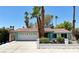 Charming single-story home with a two-car garage, tile roof, mature landscaping, and appealing curb appeal at 349 Esquina Dr, Henderson, NV 89014
