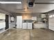 Spacious garage with built-in storage, washer, and dryer at 349 Esquina Dr, Henderson, NV 89014