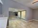 Bright living area featuring tile flooring, large mirror, and neutral paint at 349 Esquina Dr, Henderson, NV 89014