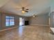 Bright, open living space with tile floors, a cozy fireplace, and sliding doors leading to the pool at 349 Esquina Dr, Henderson, NV 89014