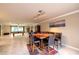 Well-lit dining room features tile floors and a wooden table with seating for six at 3597 Cochise Ln, Las Vegas, NV 89169