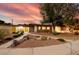 Inviting single-story home with desert landscaping, rock accents, and a welcoming entrance at 3597 Cochise Ln, Las Vegas, NV 89169
