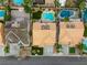 An aerial view showcases the rooftops of adjacent homes with private pools and well-manicured landscaping at 3692 River Canyon Rd, Las Vegas, NV 89129
