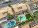 This aerial view showcases a backyard with a large pool, patio area, and lush landscaping for outdoor enjoyment at 3692 River Canyon Rd, Las Vegas, NV 89129