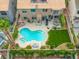 An aerial view features a backyard with a private pool, patio area, and mature landscaping for outdoor enjoyment at 3692 River Canyon Rd, Las Vegas, NV 89129