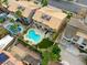 This aerial view showcases a backyard with a large pool, patio area, and lush landscaping for outdoor living at 3692 River Canyon Rd, Las Vegas, NV 89129