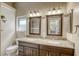 Stylish bathroom featuring dual sinks, granite counters, and framed mirrors at 3692 River Canyon Rd, Las Vegas, NV 89129