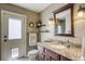 Cozy bathroom with granite counters and door leading outside at 3692 River Canyon Rd, Las Vegas, NV 89129