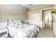 Cozy bedroom featuring soft carpet and white wainscoting, offering a relaxing and inviting space at 3692 River Canyon Rd, Las Vegas, NV 89129