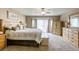 Spacious bedroom with a ceiling fan, offering a comfortable and serene retreat with ample natural light at 3692 River Canyon Rd, Las Vegas, NV 89129