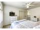 Well-lit bedroom with carpet, closet and dresser near a bed at 3692 River Canyon Rd, Las Vegas, NV 89129