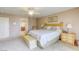 Spacious bedroom with ceiling fan and private entry to bathroom, providing comfort and convenience at 3692 River Canyon Rd, Las Vegas, NV 89129