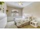 Bright bedroom with carpet, window, and a single bed frame at 3692 River Canyon Rd, Las Vegas, NV 89129