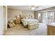 Spacious bedroom with a ceiling fan, offering a comfortable and serene retreat with ample natural light at 3692 River Canyon Rd, Las Vegas, NV 89129