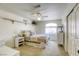 Bright bedroom featuring carpet, a ceiling fan, and ample natural light at 3692 River Canyon Rd, Las Vegas, NV 89129