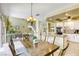 Dining area with chandelier lighting, open view, and staircase at 3692 River Canyon Rd, Las Vegas, NV 89129