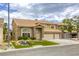 Charming two-story home with a three-car garage and well-maintained front yard at 3692 River Canyon Rd, Las Vegas, NV 89129