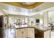 Well-lit kitchen with granite countertops, stainless steel appliances, and backyard views at 3692 River Canyon Rd, Las Vegas, NV 89129