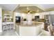 Open kitchen featuring an island with granite countertop and stainless steel appliances at 3692 River Canyon Rd, Las Vegas, NV 89129