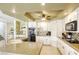 Open kitchen featuring granite countertops, a breakfast bar, and modern appliances at 3692 River Canyon Rd, Las Vegas, NV 89129