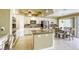 Bright kitchen featuring white cabinets, tile backsplash, granite countertops, and stainless steel appliances at 3692 River Canyon Rd, Las Vegas, NV 89129