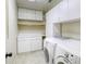 Efficient laundry room featuring cabinets and a washer/dryer at 3692 River Canyon Rd, Las Vegas, NV 89129