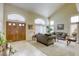 Bright and airy living room featuring high ceilings and large windows at 3692 River Canyon Rd, Las Vegas, NV 89129