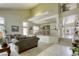 Open living space with high ceilings, a dining area and multiple windows at 3692 River Canyon Rd, Las Vegas, NV 89129