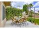 Inviting patio area with lush greenery, string lights, and a comfortable seating arrangement at 3692 River Canyon Rd, Las Vegas, NV 89129