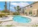 Sparkling pool with a built-in spa, surrounded by a spacious deck and lush landscaping at 3692 River Canyon Rd, Las Vegas, NV 89129