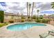 Inviting pool and spa area with ample seating, lush landscaping, and a relaxing atmosphere at 3692 River Canyon Rd, Las Vegas, NV 89129