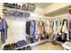 Walk-in closet with ample hanging space and shelving, ideal for organizing clothes and accessories at 3692 River Canyon Rd, Las Vegas, NV 89129