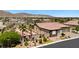 An aerial view of the home showing desert landscaping, privacy wall, and mature palm trees at 4317 Velvet Ridge Ct, Las Vegas, NV 89129