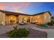 Cozy patio with a seating area and desert landscaping at sunset at 4317 Velvet Ridge Ct, Las Vegas, NV 89129