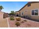 Well-maintained backyard with a small garden, stone borders, and a gravel area at 4317 Velvet Ridge Ct, Las Vegas, NV 89129