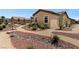 Landscaped backyard featuring desert landscaping, meandering walkways, and natural rock accents at 4317 Velvet Ridge Ct, Las Vegas, NV 89129