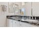 Elegant bathroom vanity with dual sinks, marble countertop, and white cabinetry at 4317 Velvet Ridge Ct, Las Vegas, NV 89129