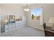 Bright bedroom with a large window, a modern light fixture, and ample storage at 4317 Velvet Ridge Ct, Las Vegas, NV 89129