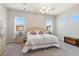 Well-lit bedroom with carpet, side tables, and a bright, welcoming atmosphere at 4317 Velvet Ridge Ct, Las Vegas, NV 89129